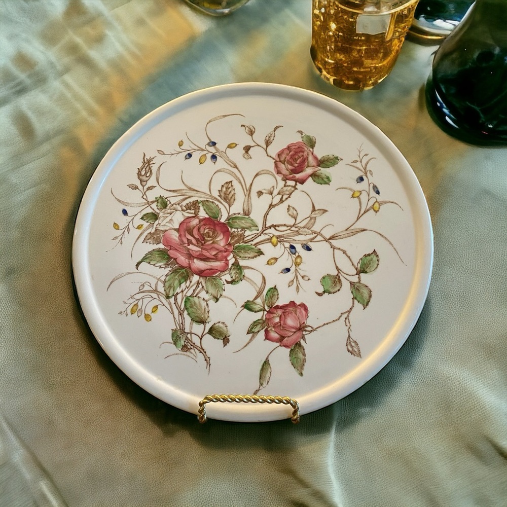 Vintage cake plate white with roses and vines. Measures 11” across